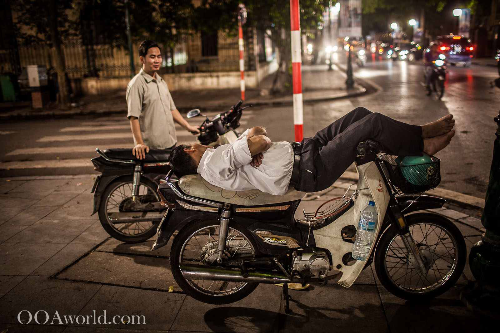 Hanoi Street Photography Sleeping on Moped Vietnam Photo Ooaworld