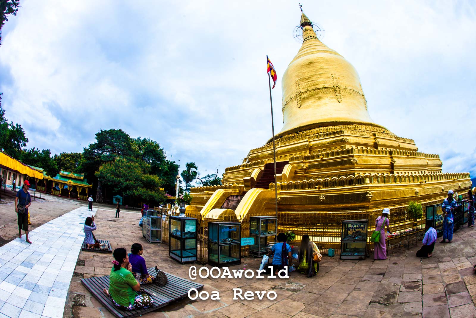Bagan LandscapesPart II Bagan Golden Pagoda in Myanmar with worshippers and blue sky Photo OOAworld