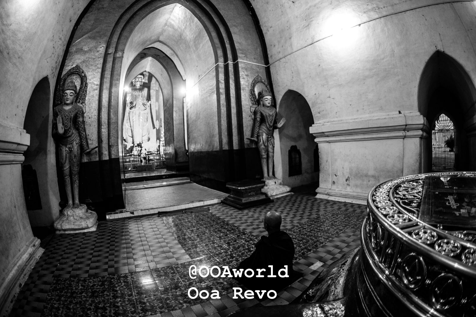 Bagan People Part I Bagan Monk meditating in ancient temple with statues and arches Photo OOAworld