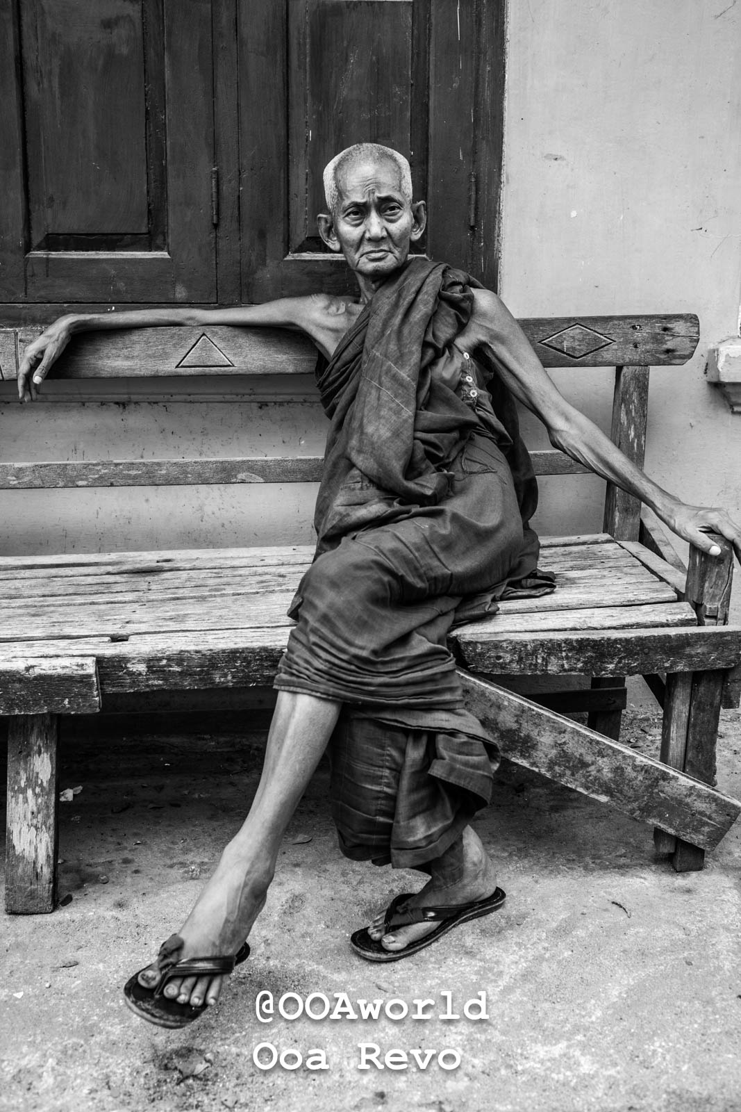 Bagan Portraits Bagan elderly monk sitting on wooden bench black and white Photo OOAworld