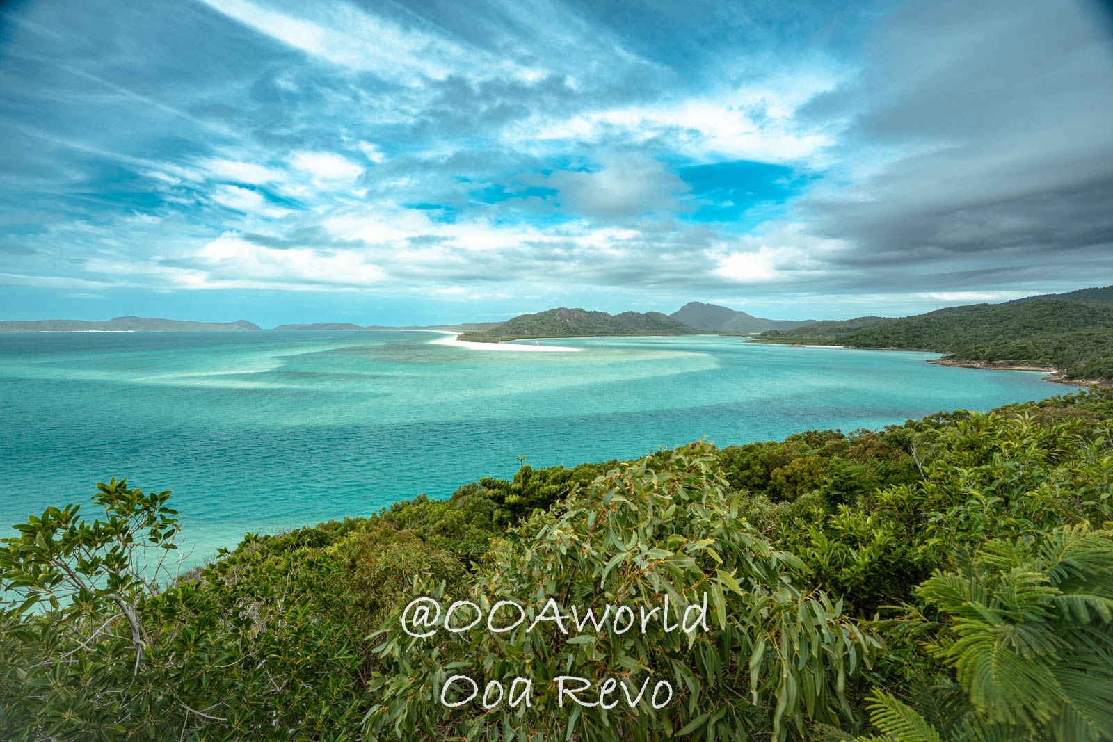 Airlie Beach Whitsundays Australia Scenic view of turquoise ocean and lush greenery Photo OOAworld