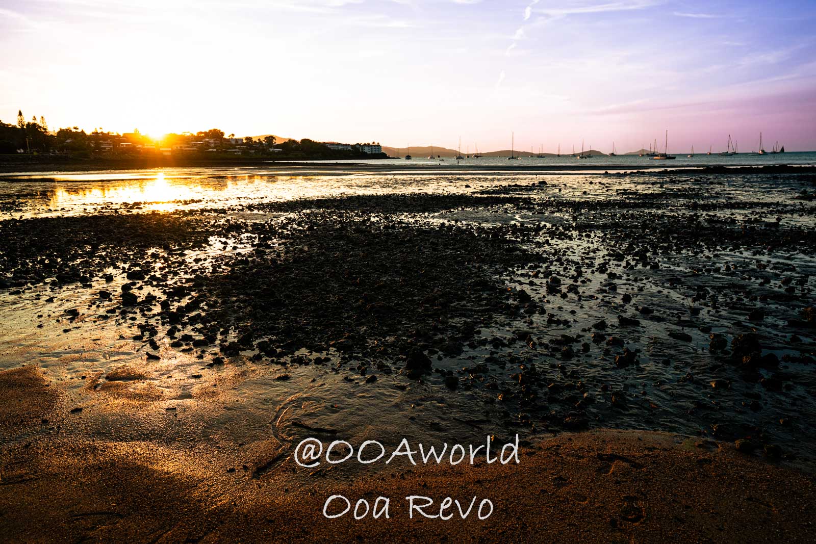 Airlie Beach Whitsundays Australia sunset over rocky beach low tide Photo OOAworld