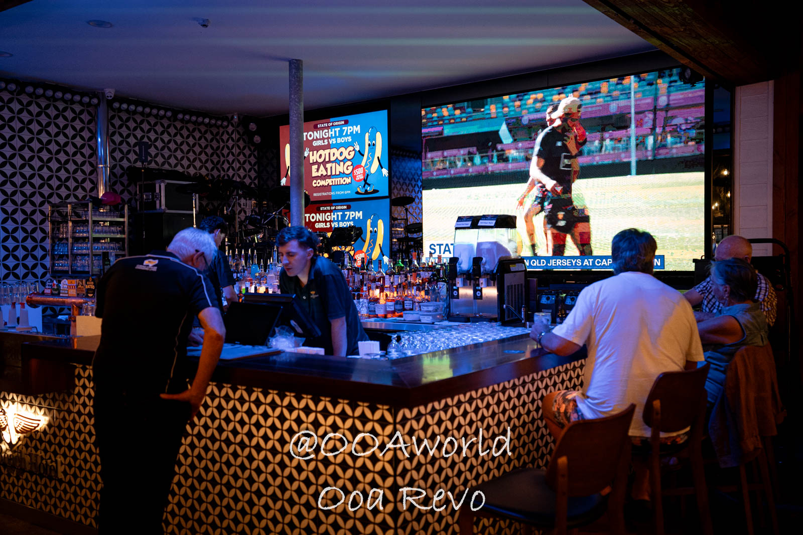 Airlie Beach Whitsundays Australia bar interior night scene with customers and screens Photo OOAworld