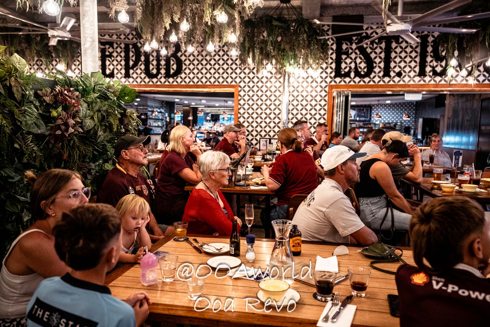 Airlie Beach Whitsundays Australia people enjoying drinks and conversation in a cozy pub Photo OOAworld