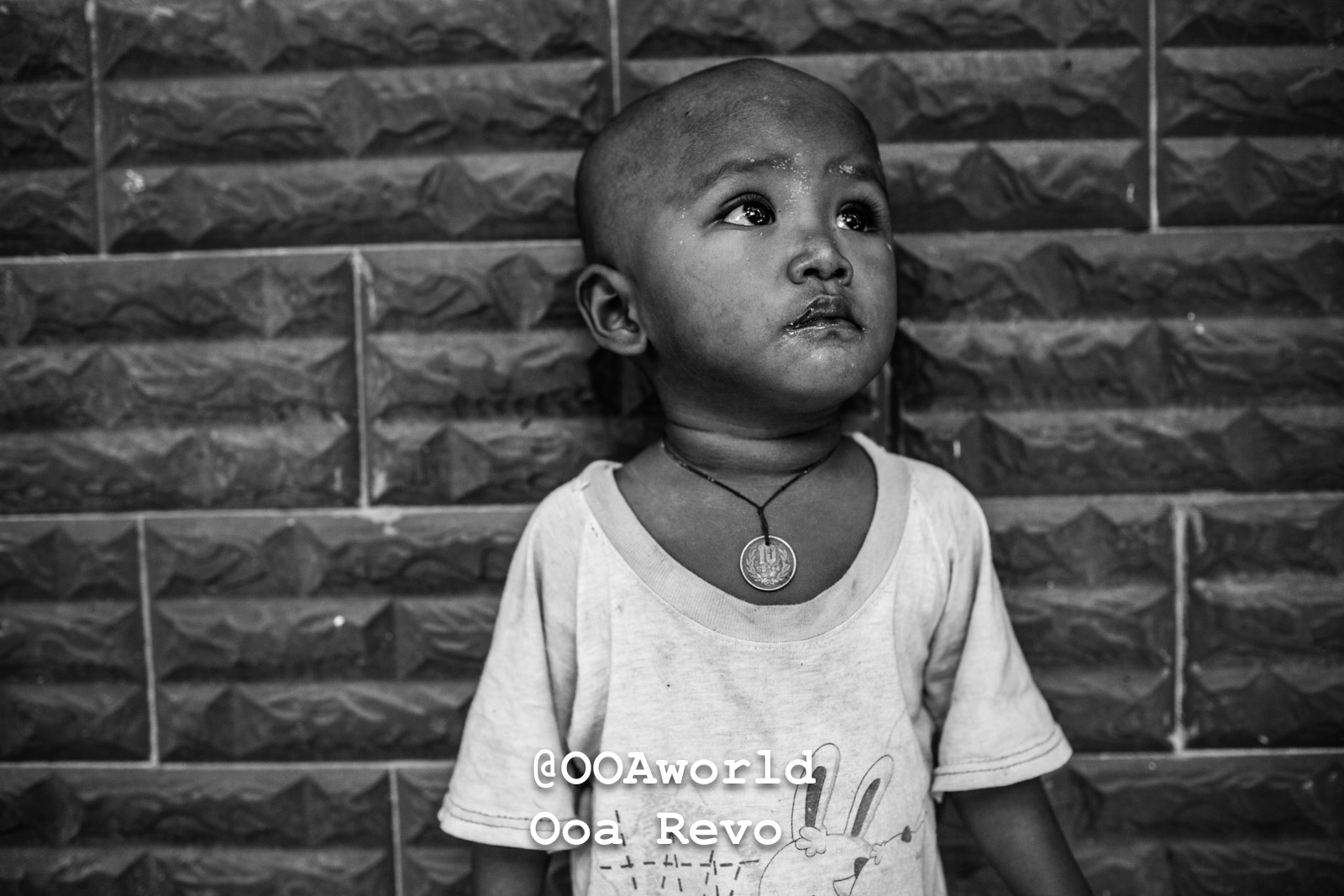 Amapura Myanmar black and white portrait of a child against textured wall Photo OOAworld Amapura Myanmar black and white portrait of a child against textured wall Photo OOAworld
