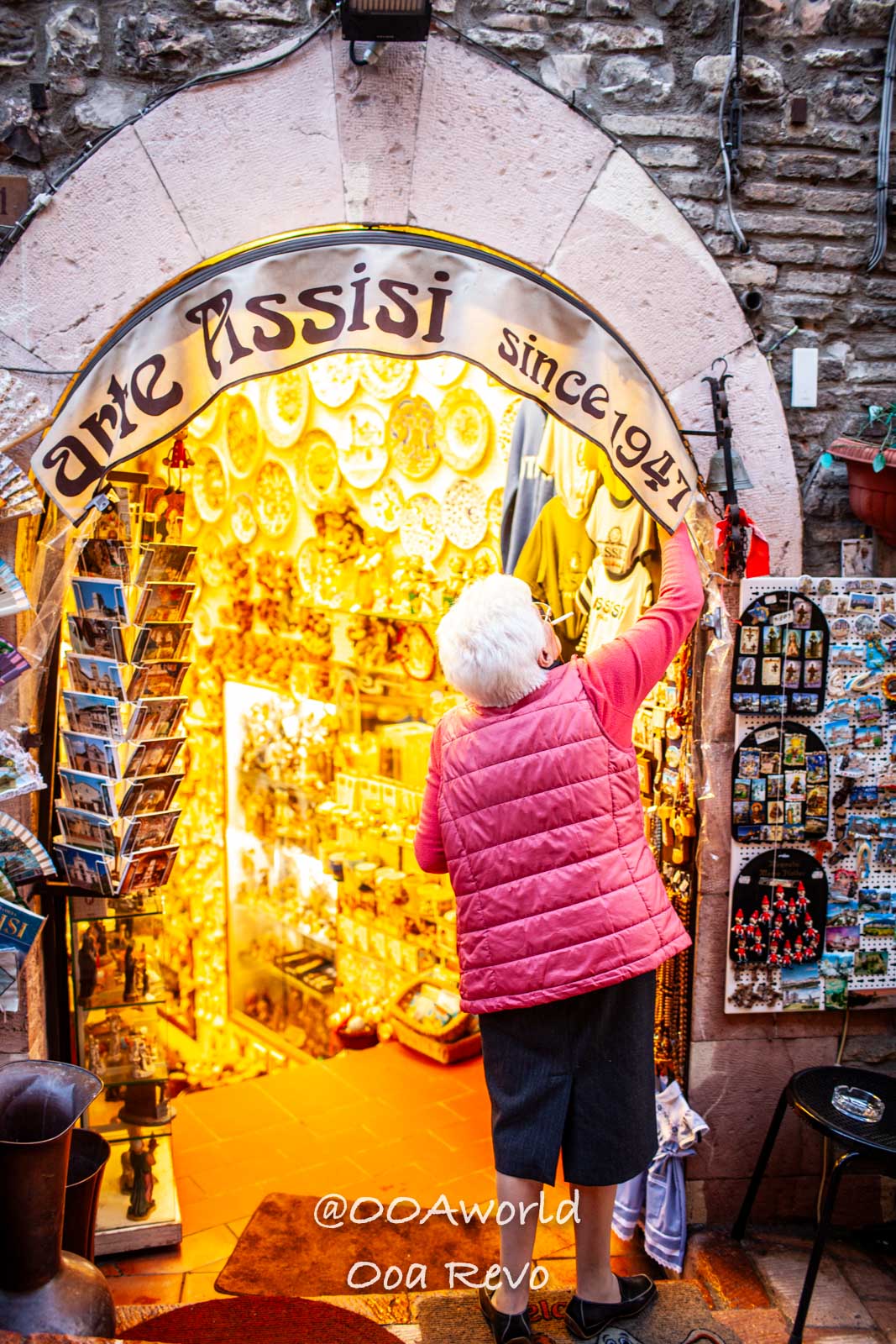 Assissi Italy woman shopping at Assisi souvenir shop Photo OOAworld