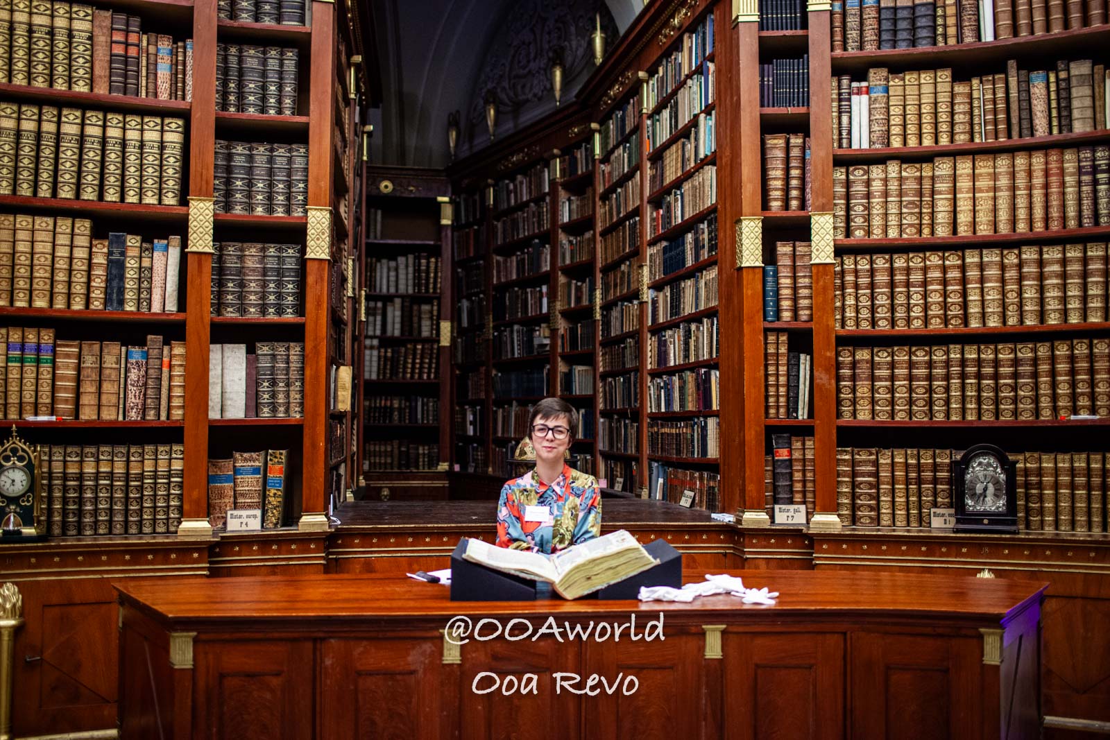 Vienna Austria librarian in historic library filled with antique books Photo OOAworld