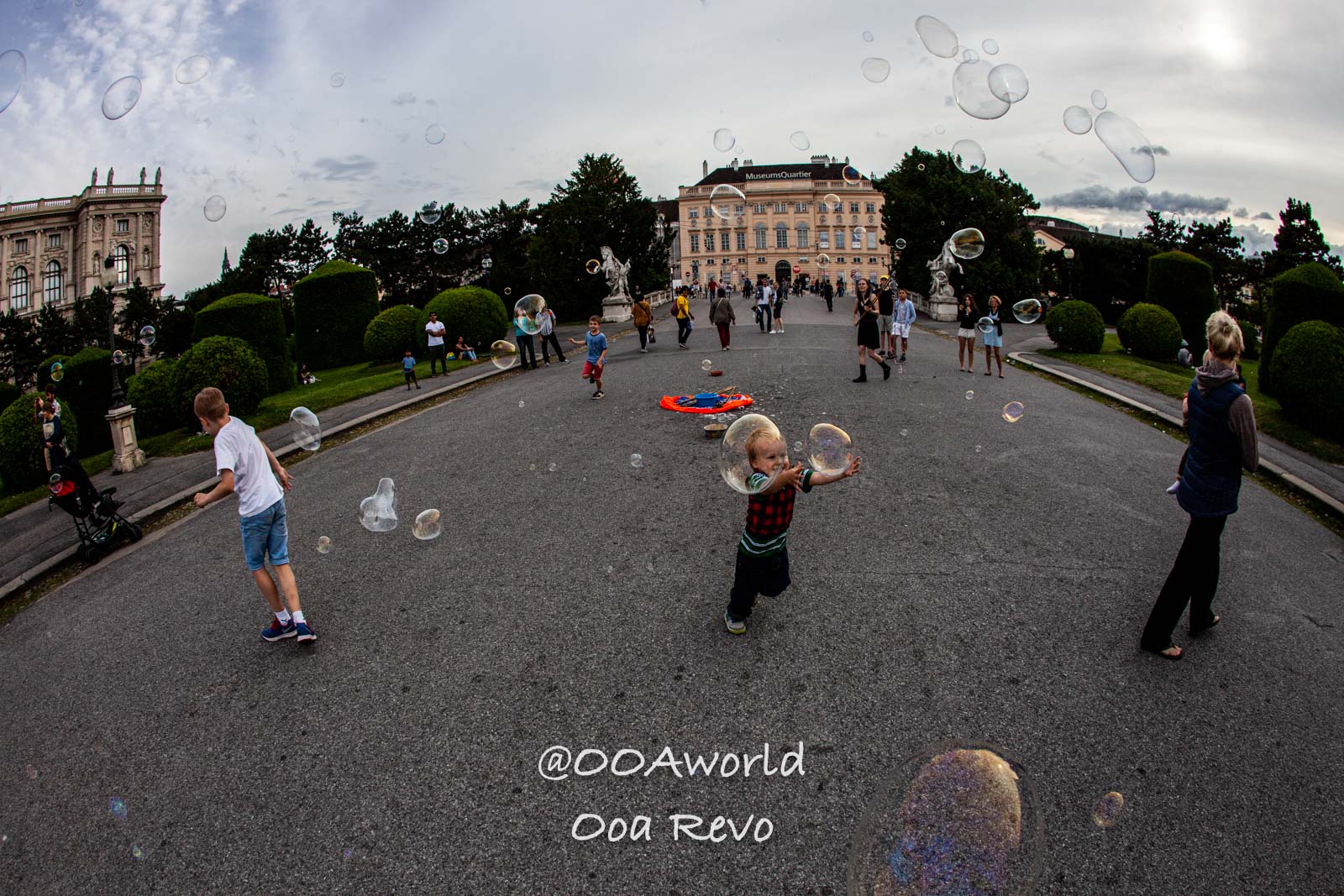 Vienna Austria children playing with bubbles Vienna MuseumQuartier Photo OOAworld