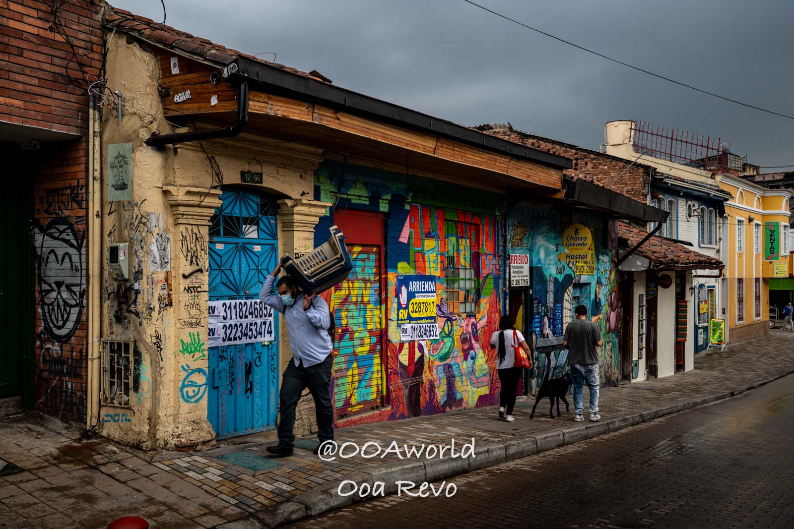 La Candelaria Bogota Colorful street art and pedestrians in Bogotá Photo OOAworld