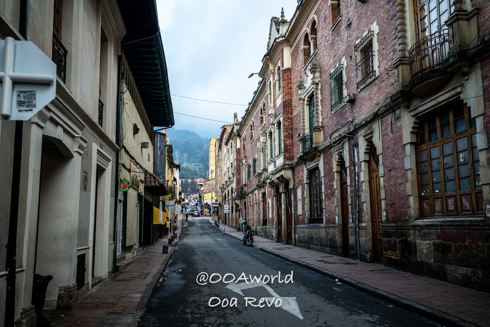 La Candelaria Bogota historic street in Bogotá Colombia with brick buildings Photo OOAworld