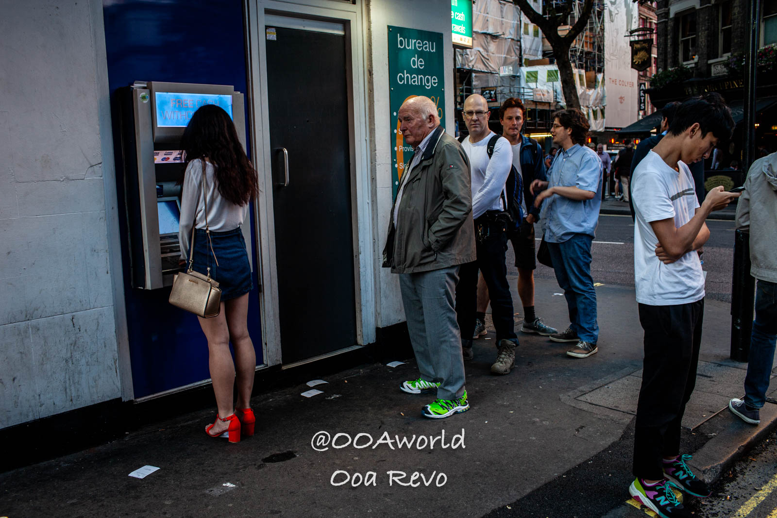 Covent Garden Central London London Urban ATM Queue Snapshot Photo OOAworld Covent Garden Central London London People waiting in line at ATM in urban street scene Photo OOAworld