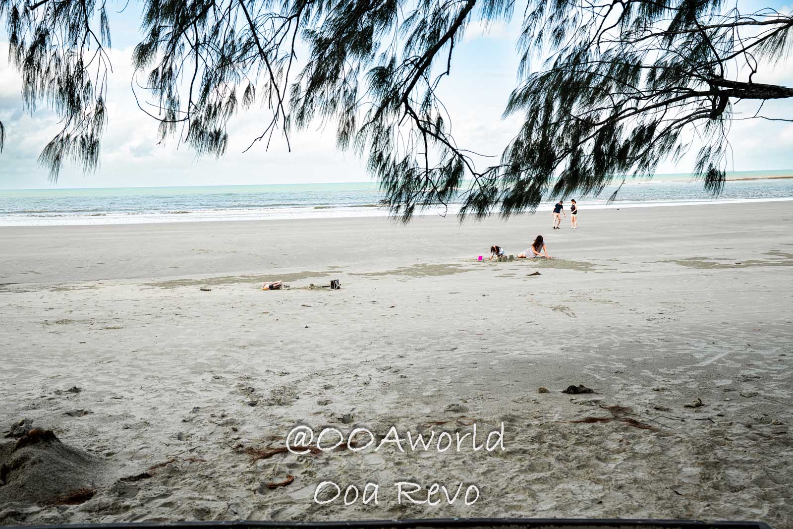 Daintree Forest Nature Landscapes Australia family relaxing on sandy beach with ocean view Photo OOAworld