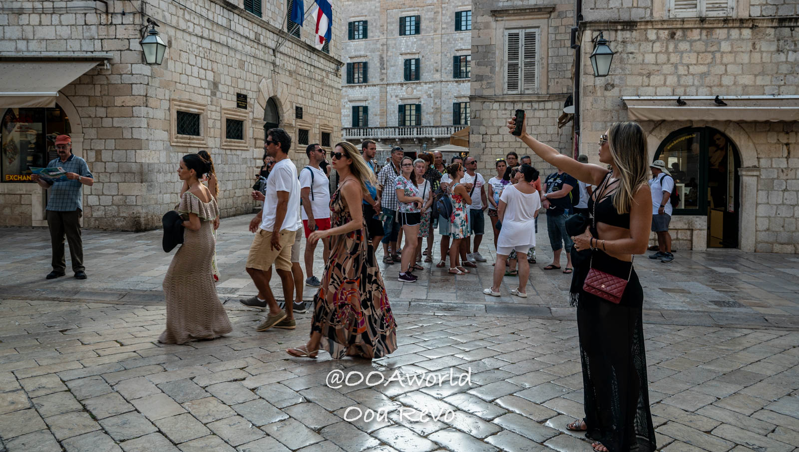 tourists exploring historic square Croatia Photo OOAworld