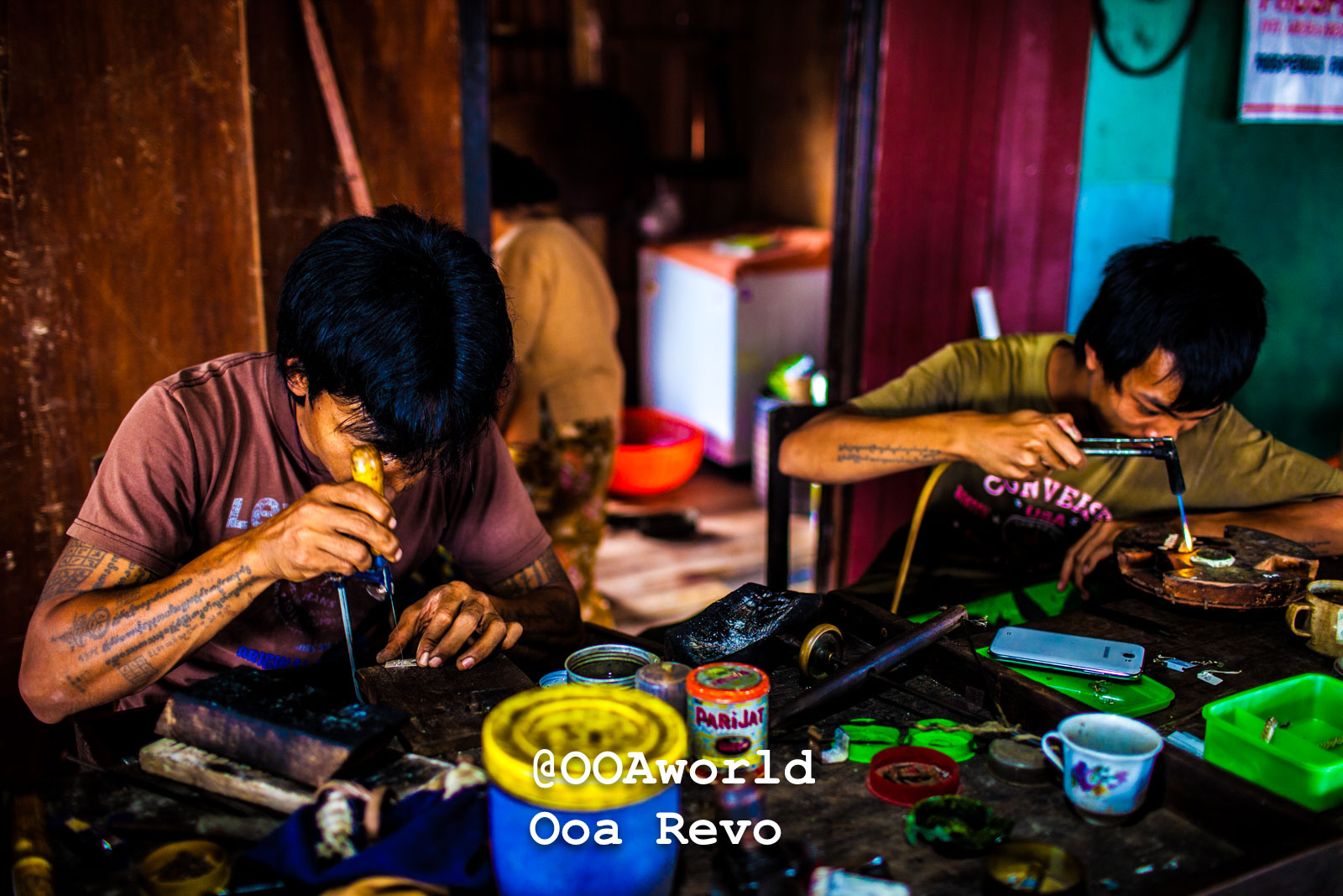 Inle Lake People and Landscape Inle Lake Southeast Asian artisans meticulously working on crafts in a workshop Photo OOAworld