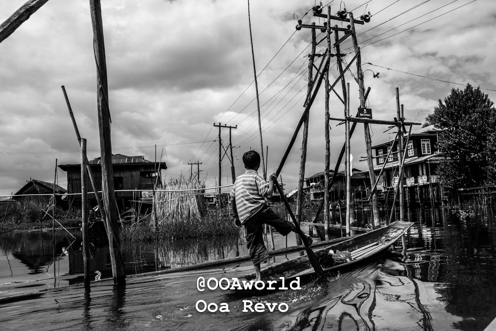 Inle Lake People and Landscape Inle Lake boy rowing boat in canal black and white Photo OOAworld