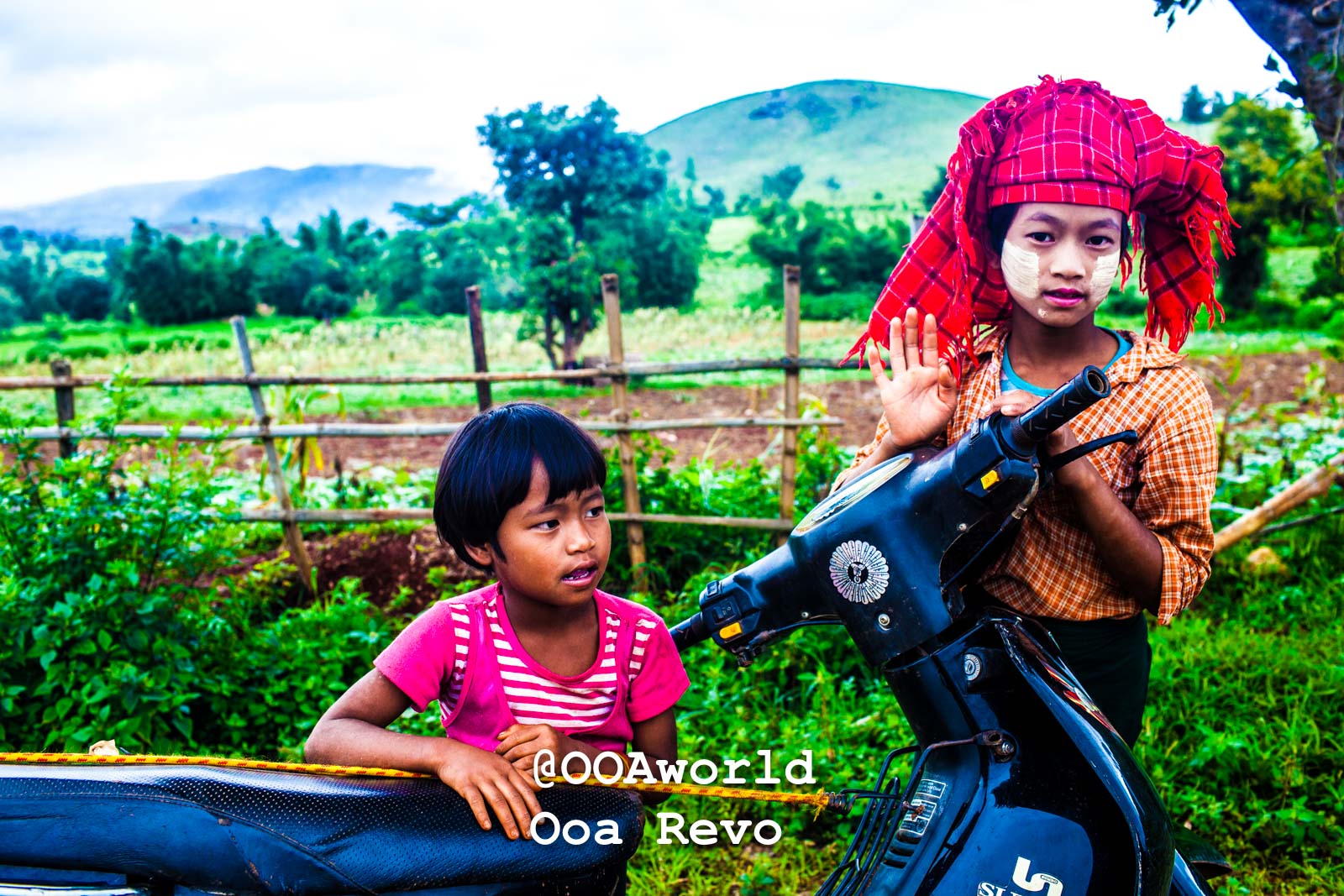 Kalaw Portraits Kalaw Htee Thein Children with traditional attire riding a motorcycle in a rural landscape Photo OOAworld