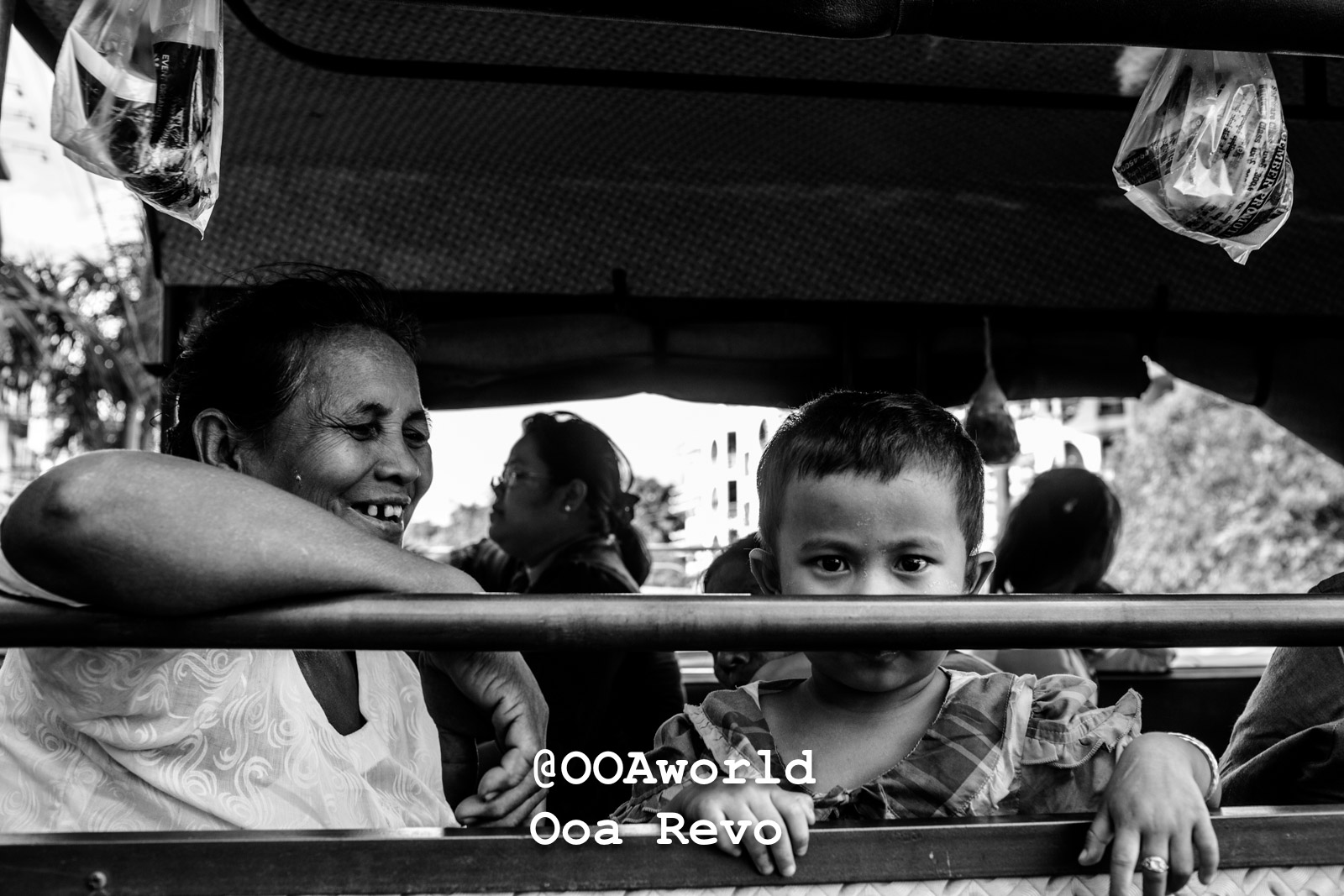 Mandalay People Mandalay Smiling woman and child on bus in black and white Photo OOAworld