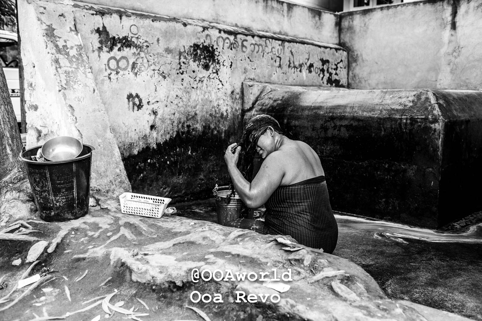 Mandalay People Mandalay Woman washing hair in rustic outdoor setting black and white Photo OOAworld