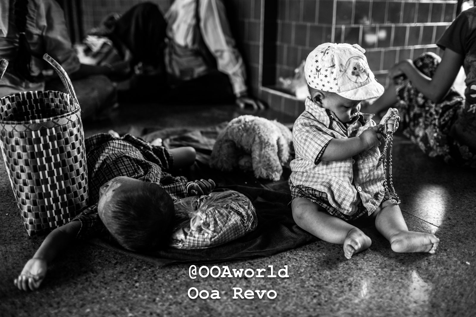 Mandalay People Mandalay black and white photo of two children sitting and playing with a chain Photo OOAworld