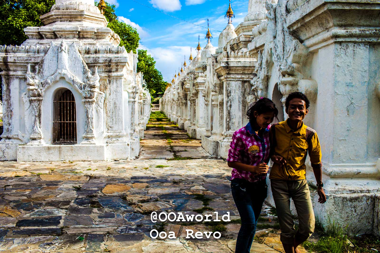 Mandalay People Mandalay young couple walking through ancient temple corridor Myanmar Photo OOAworld