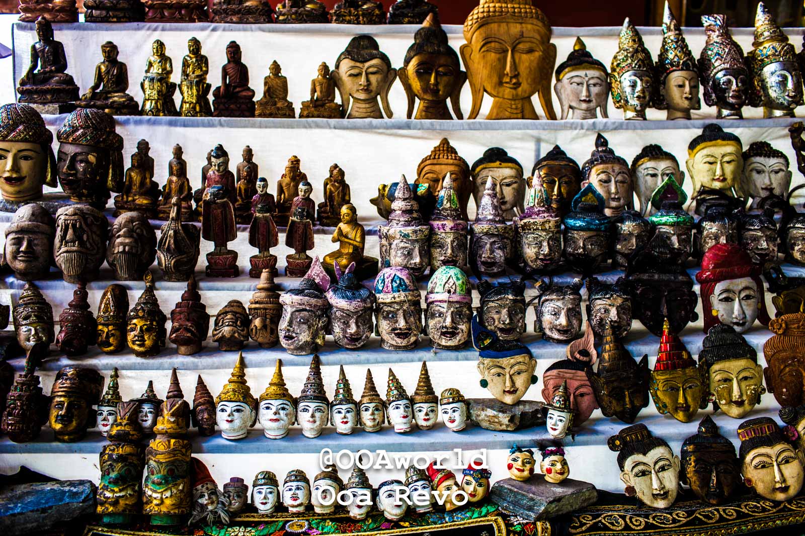 Mandalay Landscapes and Textures Mandalay Colorful Buddha Statues and Masks Collection Photo OOAworld Mandalay Landscapes and Textures Mandalay Colorful collection of wooden Buddha statues and cultural masks Photo OOAworld