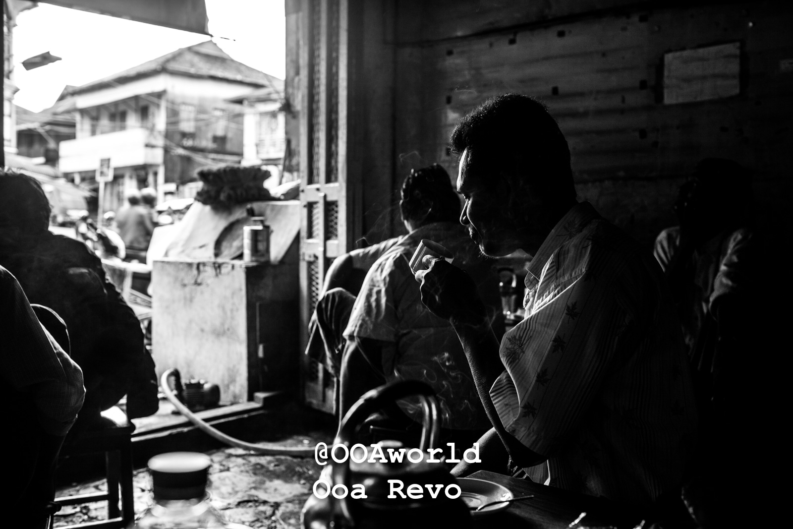 Mawlamyine Myanmar black and white silhouette of man drinking tea in a cafe Photo OOAworld