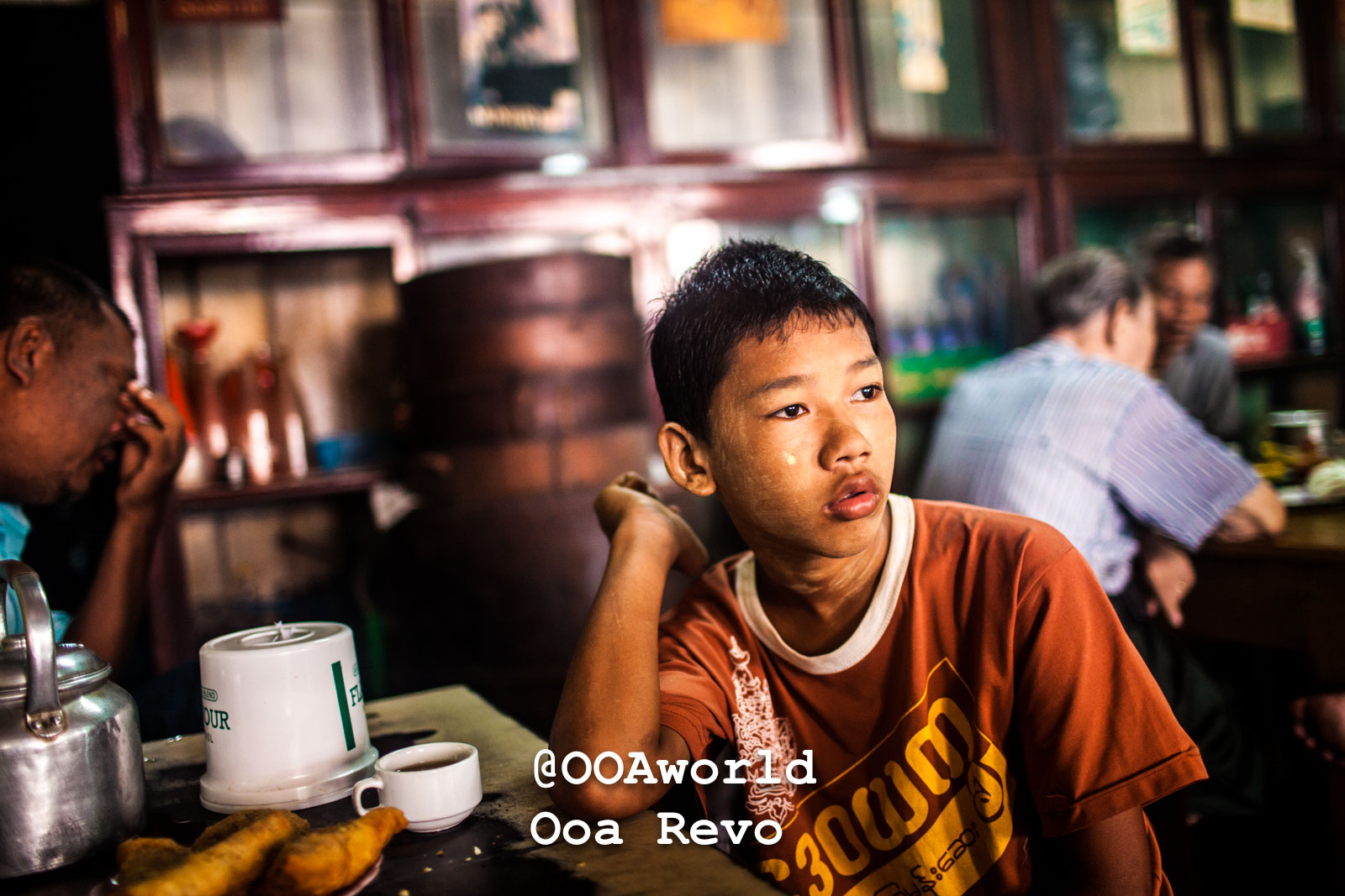 Mawlamyine Myanmar young boy in an Asian café Photo OOAworld