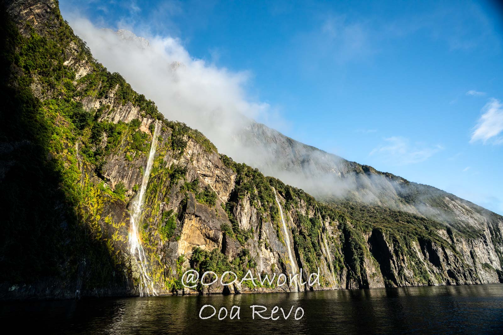 Milford Sound Fjord New Zealand Waterfalls cascading down lush cliffs Milford Sound Photo OOAworld