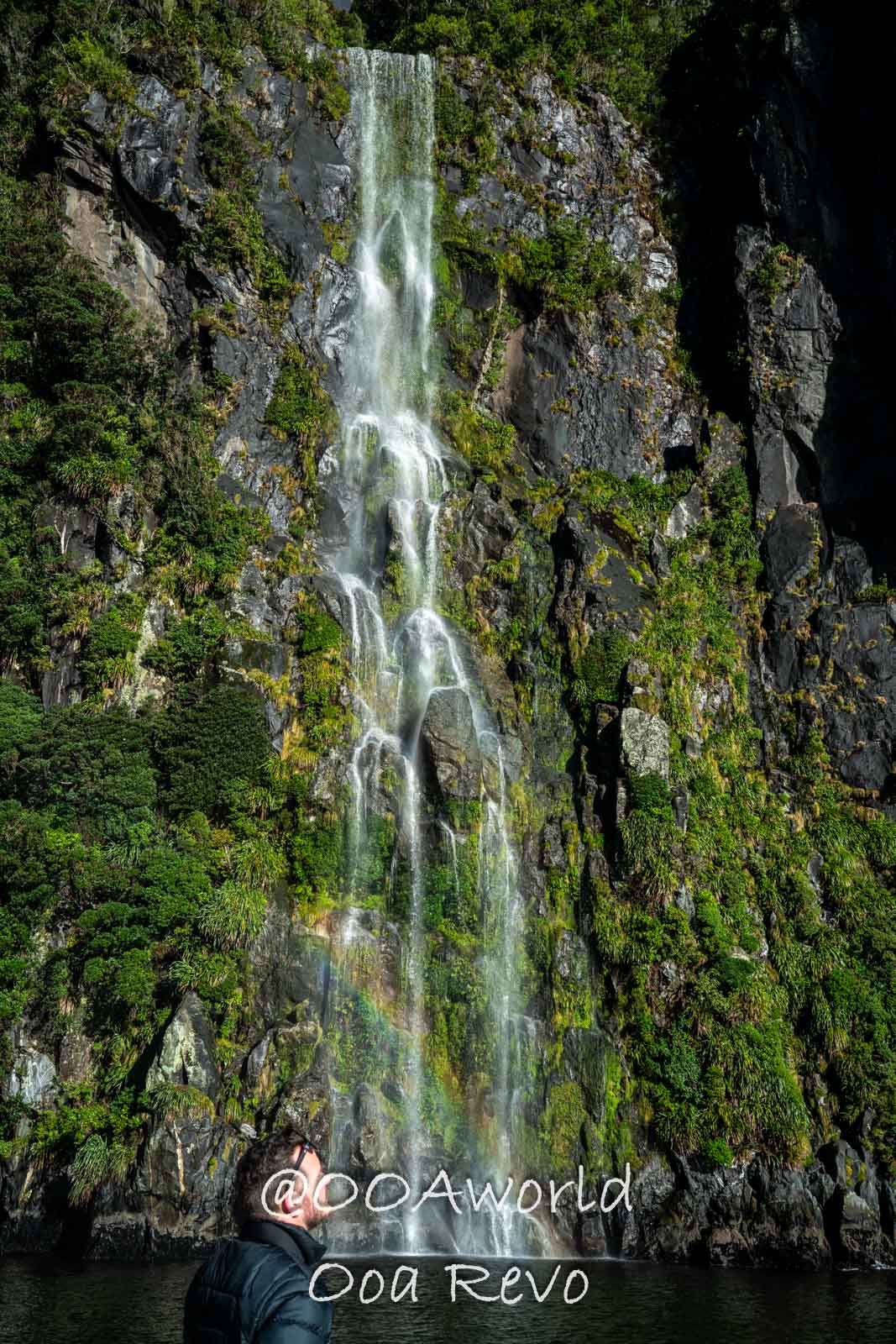 waterfall cliff greenery rainbow New Zealand Photo OOAworld