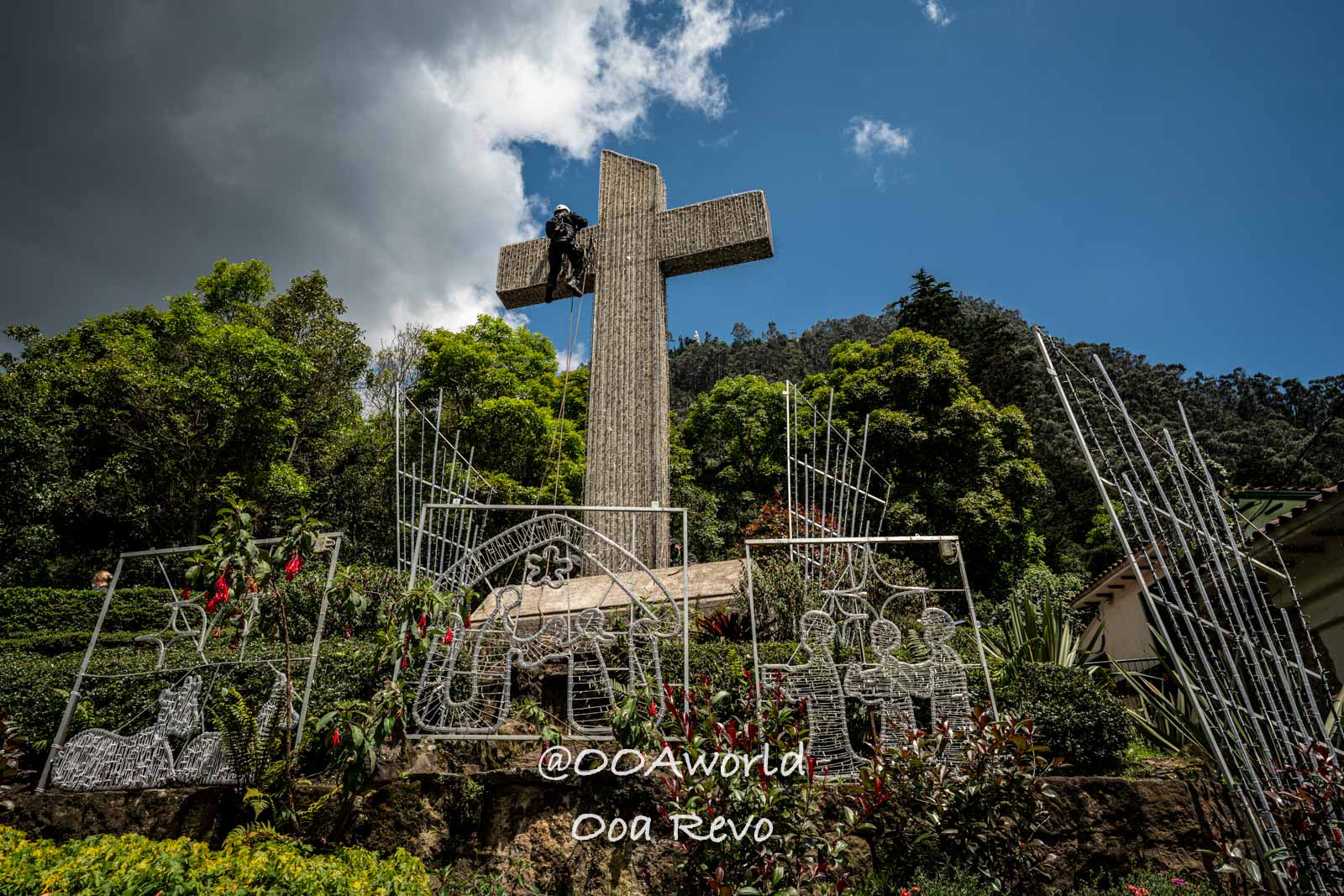 Monserrate Sanctuary Bogota large cross with climber in lush greenery Photo OOAworld