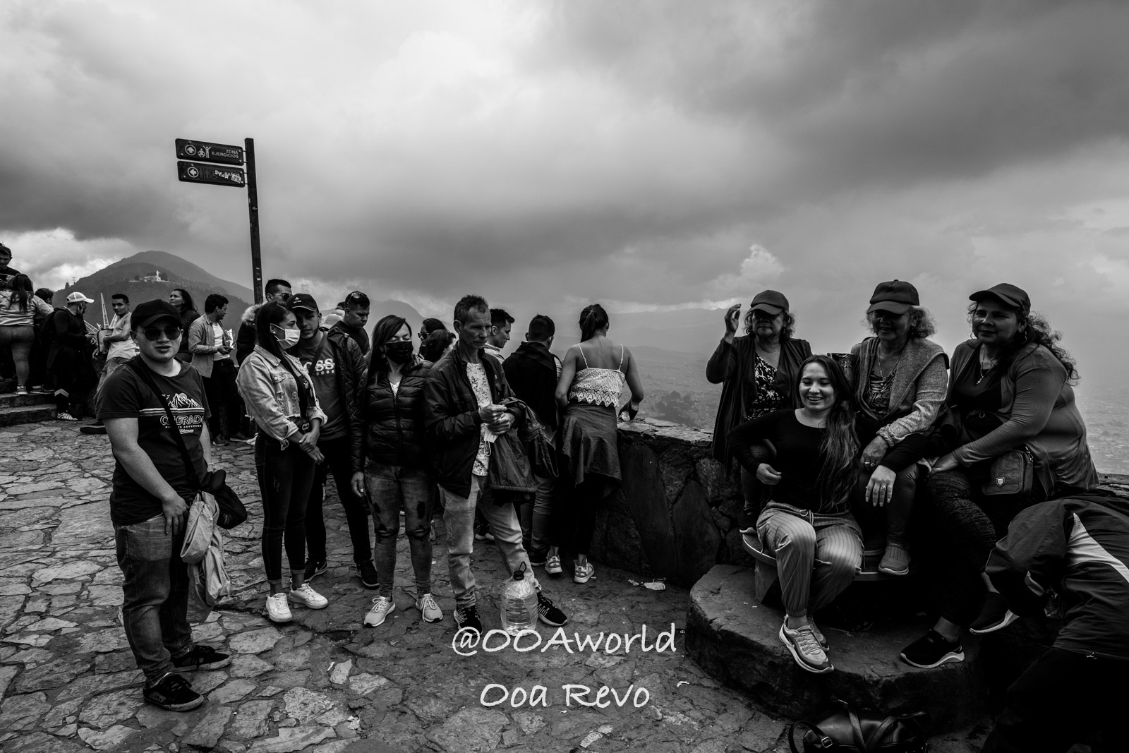Monserrate Sanctuary Bogota tourists at scenic mountain overlook Photo OOAworld Monserrate Sanctuary Bogota group of tourists at mountain viewpoint black and white Photo OOAworld