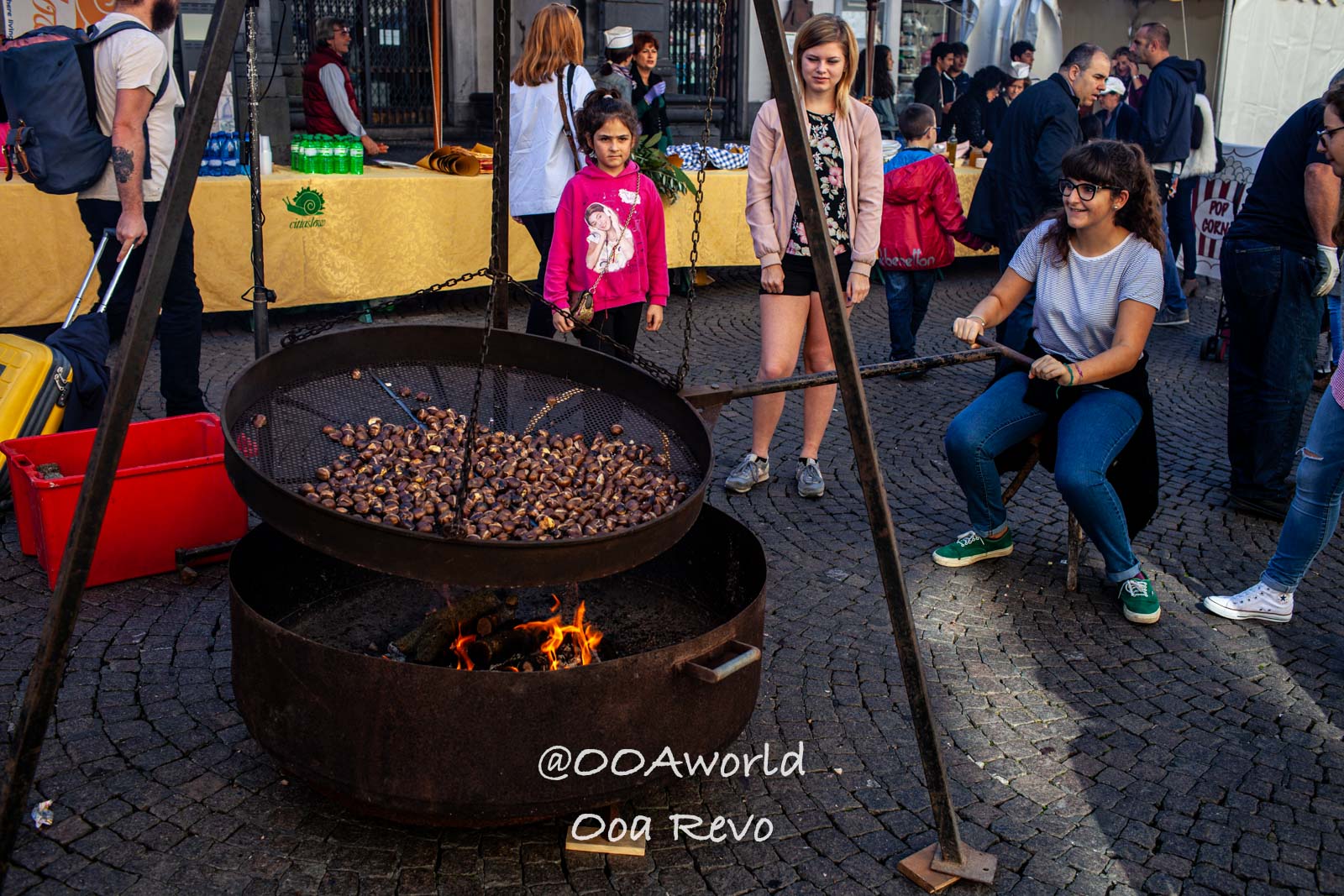 Orvieto Italy Festival Chestnut Roasting Photo OOAworld Orvieto Italy woman roasting chestnuts at an outdoor festival Photo OOAworld