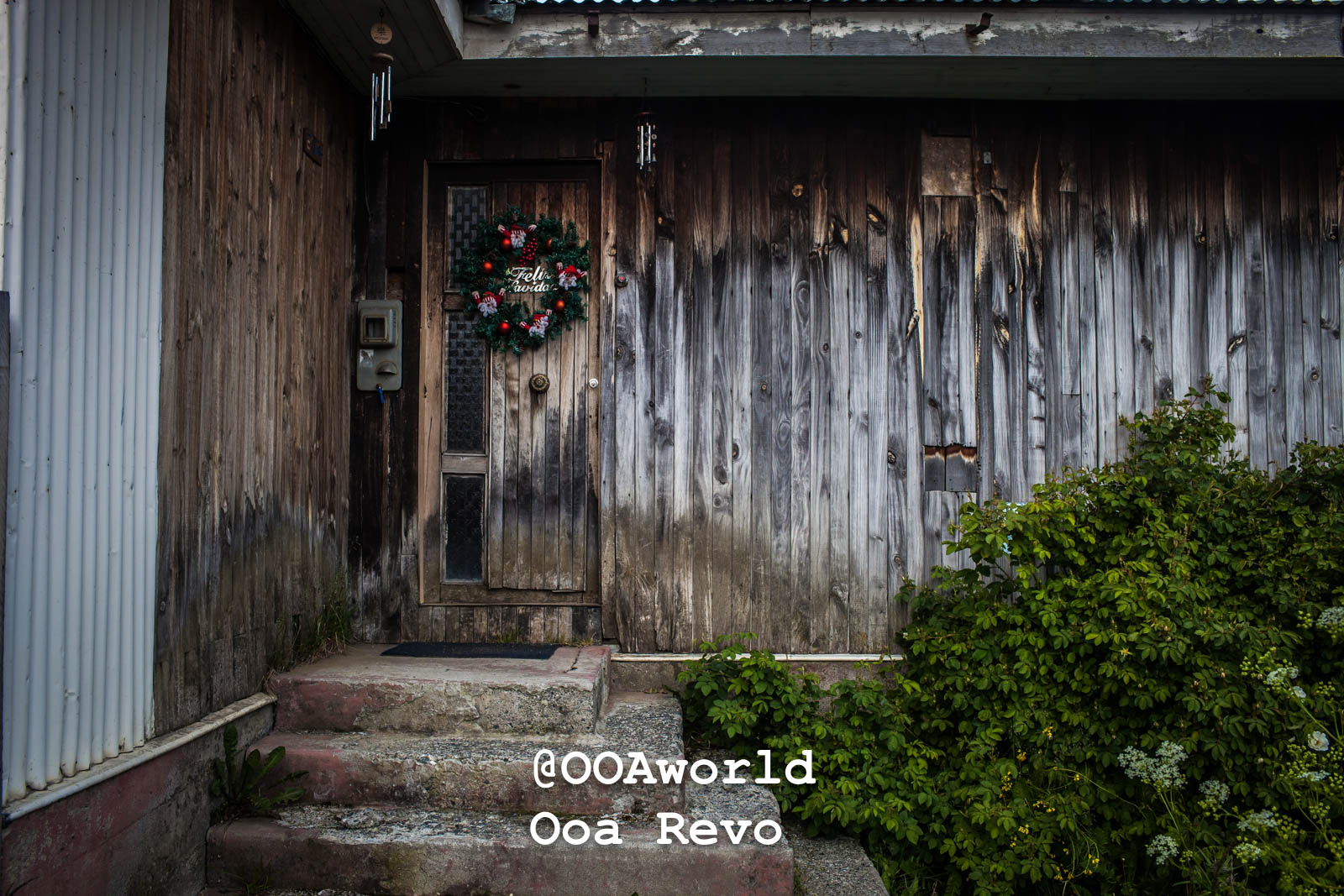 Puerto Natales Post Trek Torres Del Paine Trek weathered wooden door with festive wreath Photo OOAworld