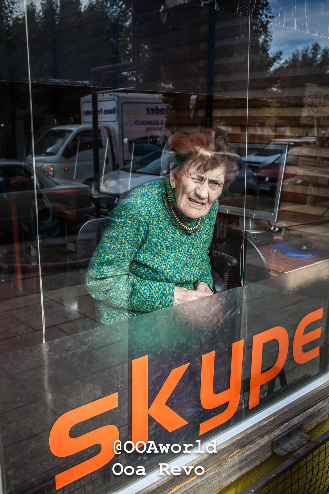 Puerto Natales Post Trek Torres Del Paine Trek Elderly woman sitting inside a cafe with a glass window Photo OOAworld