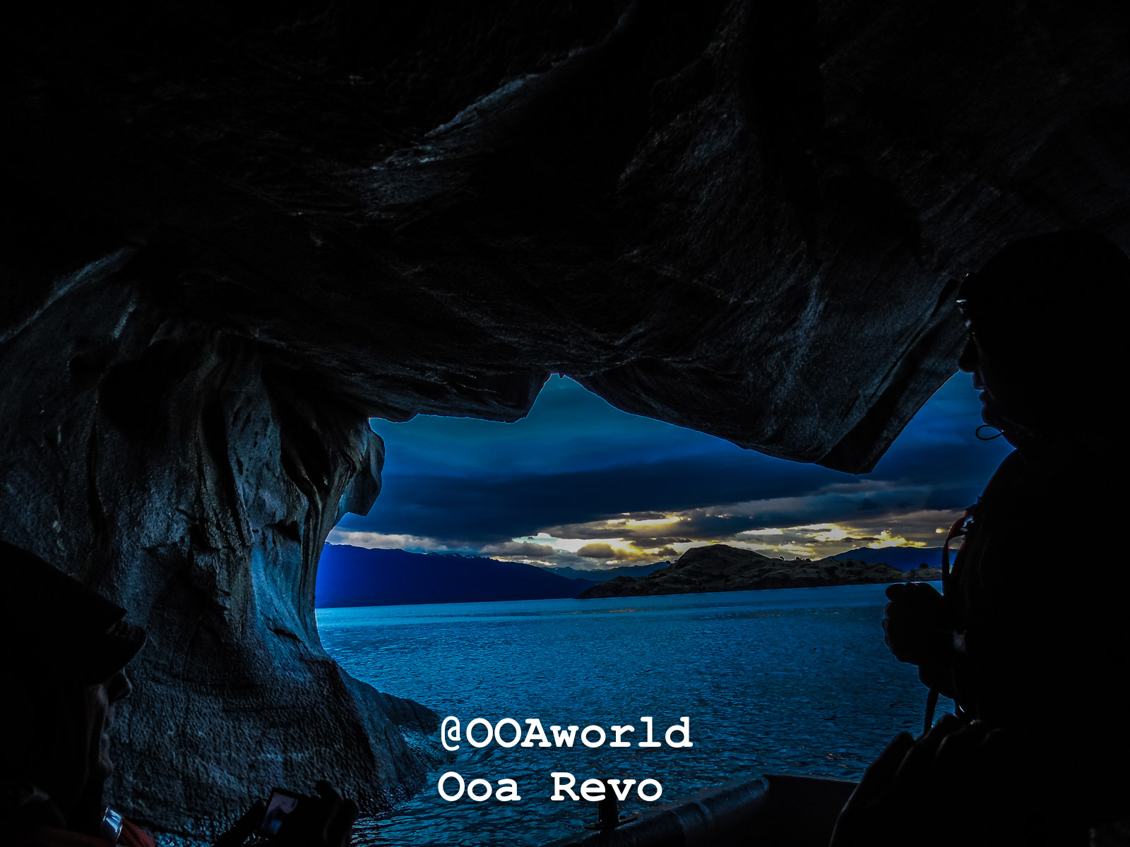 Puerto Rio Tranquilo People and Landscapes Puerto Rio Tranquilo OOAworld Majestic cave view overlooking serene lake and mountains Photo OOAworld