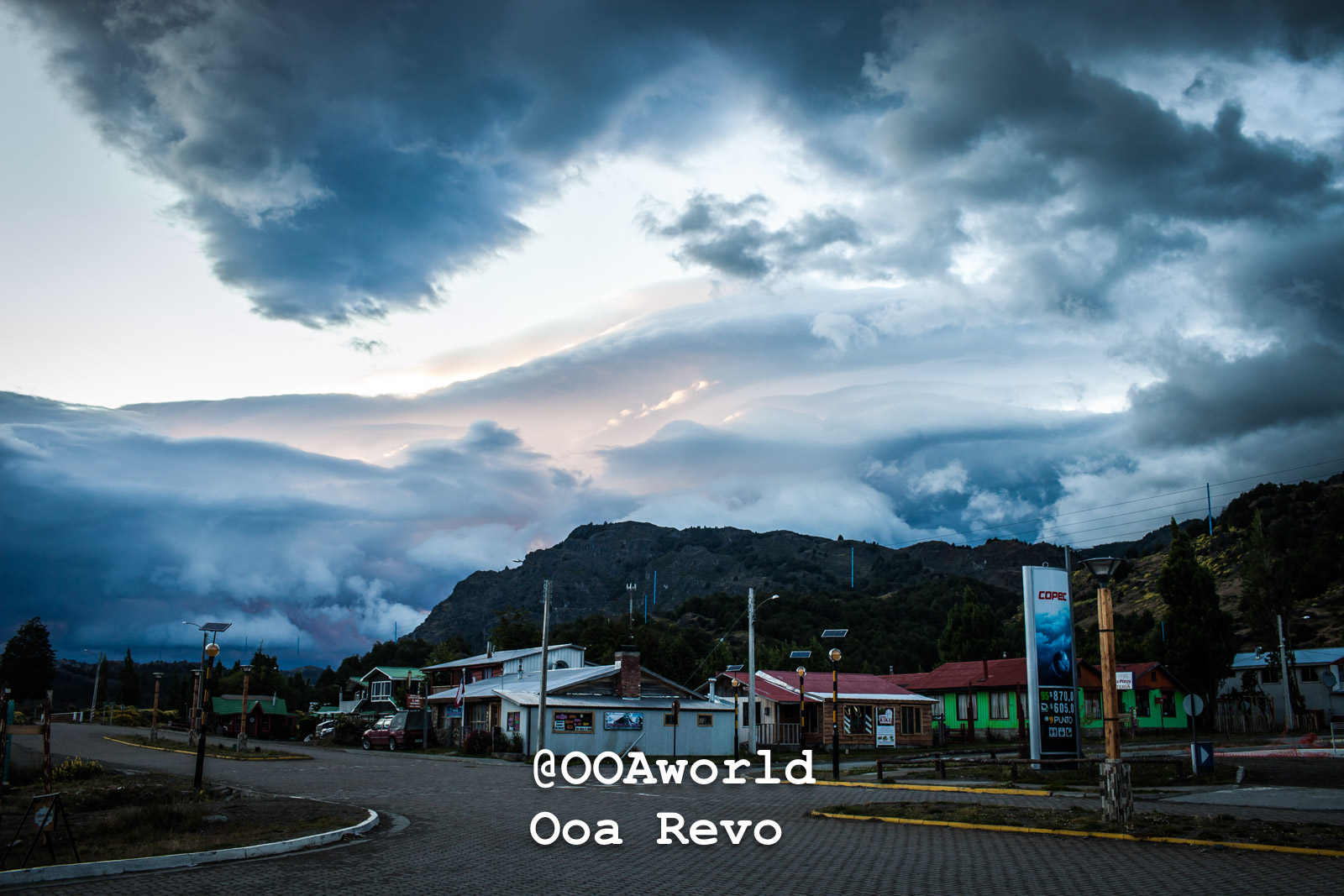 Puerto Rio Tranquilo People and Landscapes Puerto Rio Tranquilo OOAworld Dramatic cloudscape over small town and mountains Photo OOAworld
