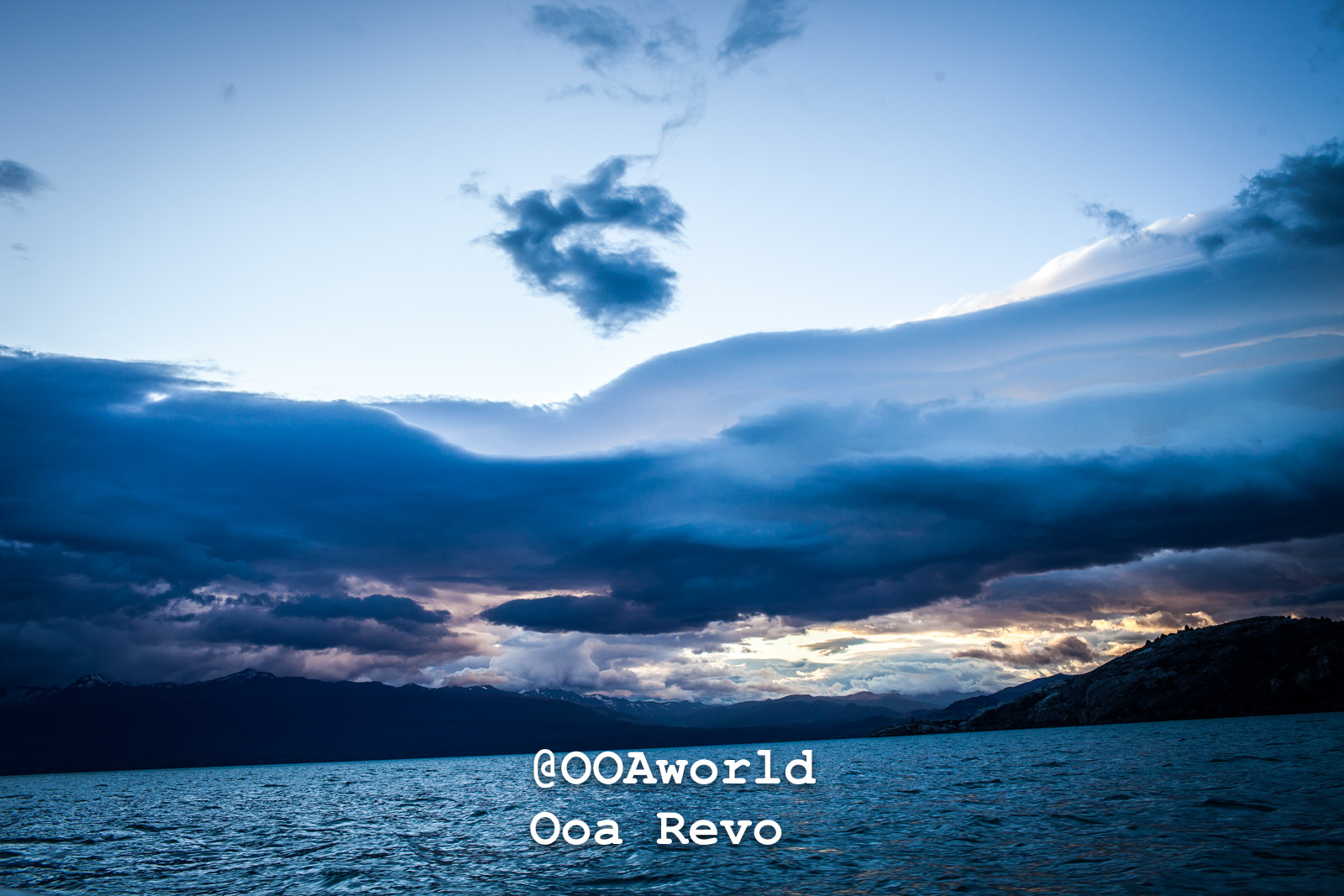 Puerto Rio Tranquilo People and Landscapes Puerto Rio Tranquilo OOAworld dramatic clouds over a tranquil lake during sunset Photo OOAworld