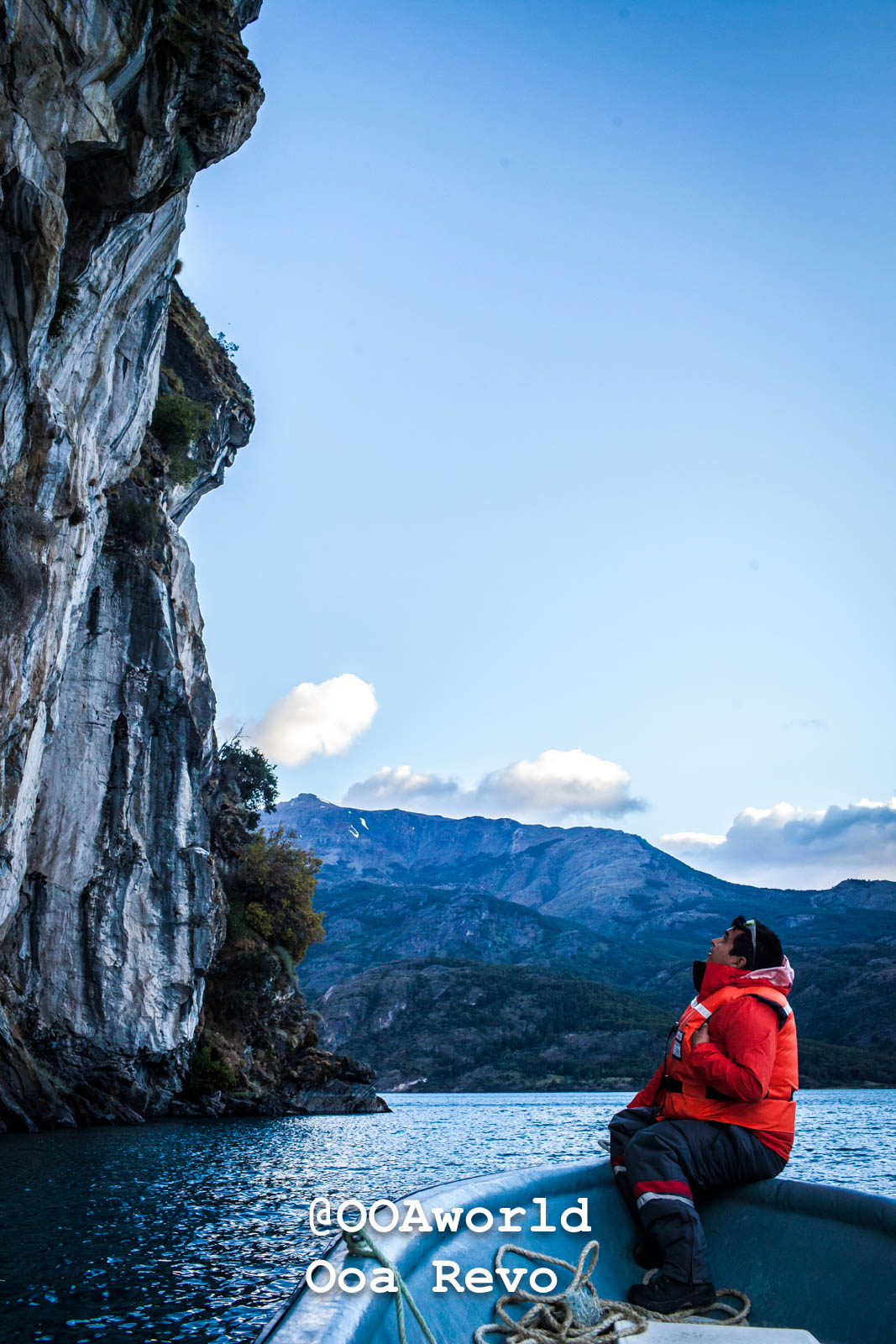 Puerto Rio Tranquilo People and Landscapes Puerto Rio Tranquilo OOAworld person on a boat admiring rocky cliffs and mountains Photo OOAworld