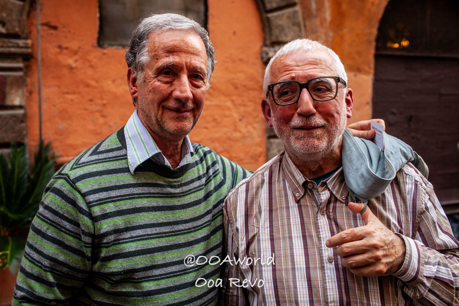 Rome Jewish Quarter Rome two elderly men smiling in front of orange wall Photo OOAworld Rome Jewish Quarter Rome two elderly men smiling in front of orange wall Photo OOAworld
