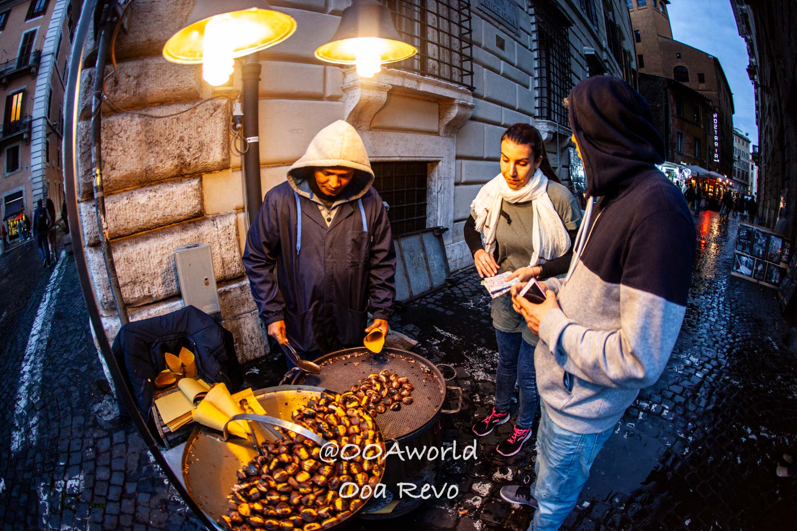 street food vendor roasting chestnuts in Rome Photo OOAworld