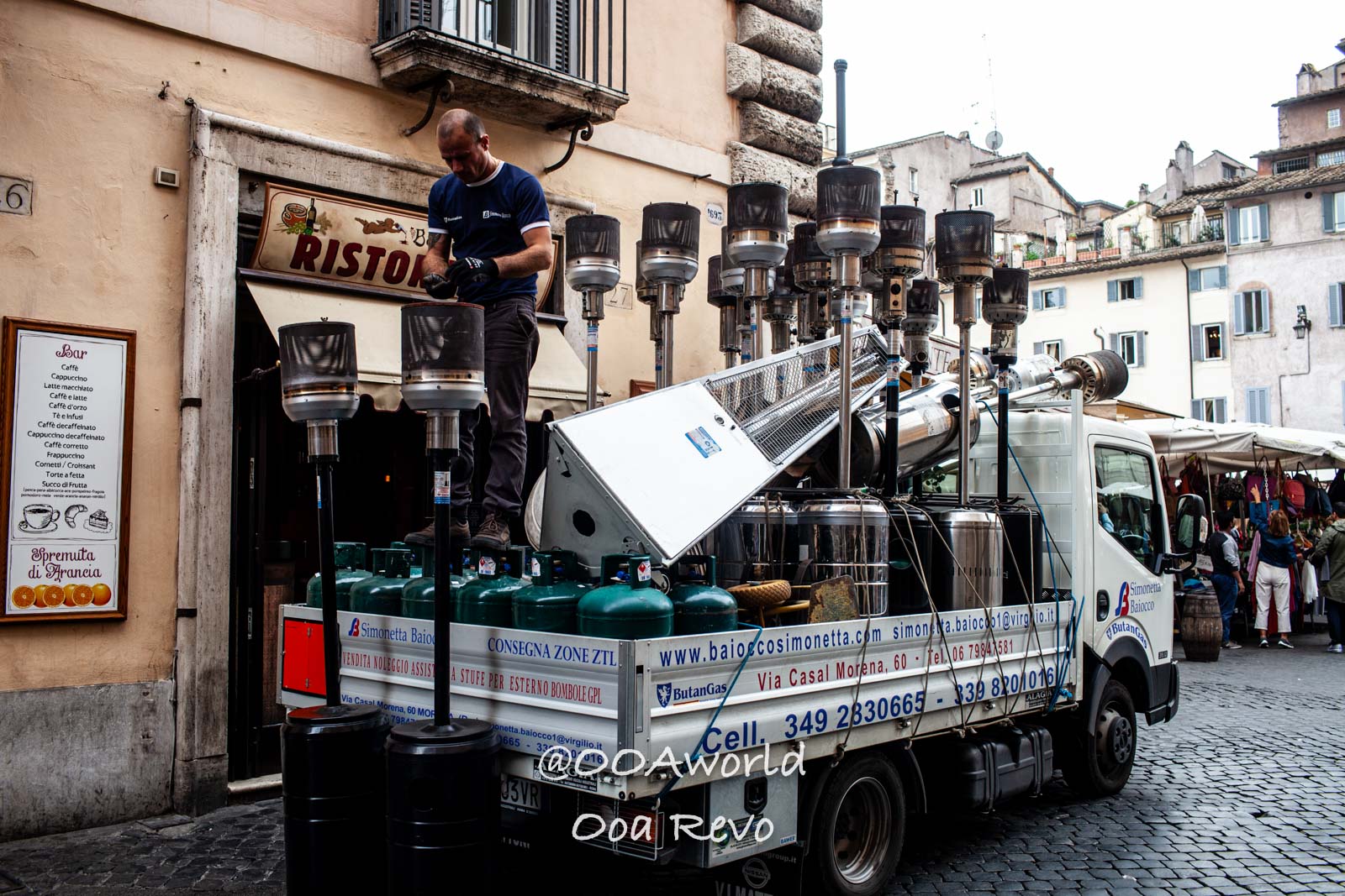Rome Street Photography Rome man working on gas heaters truck near Italian restaurant street scene Photo OOAworld