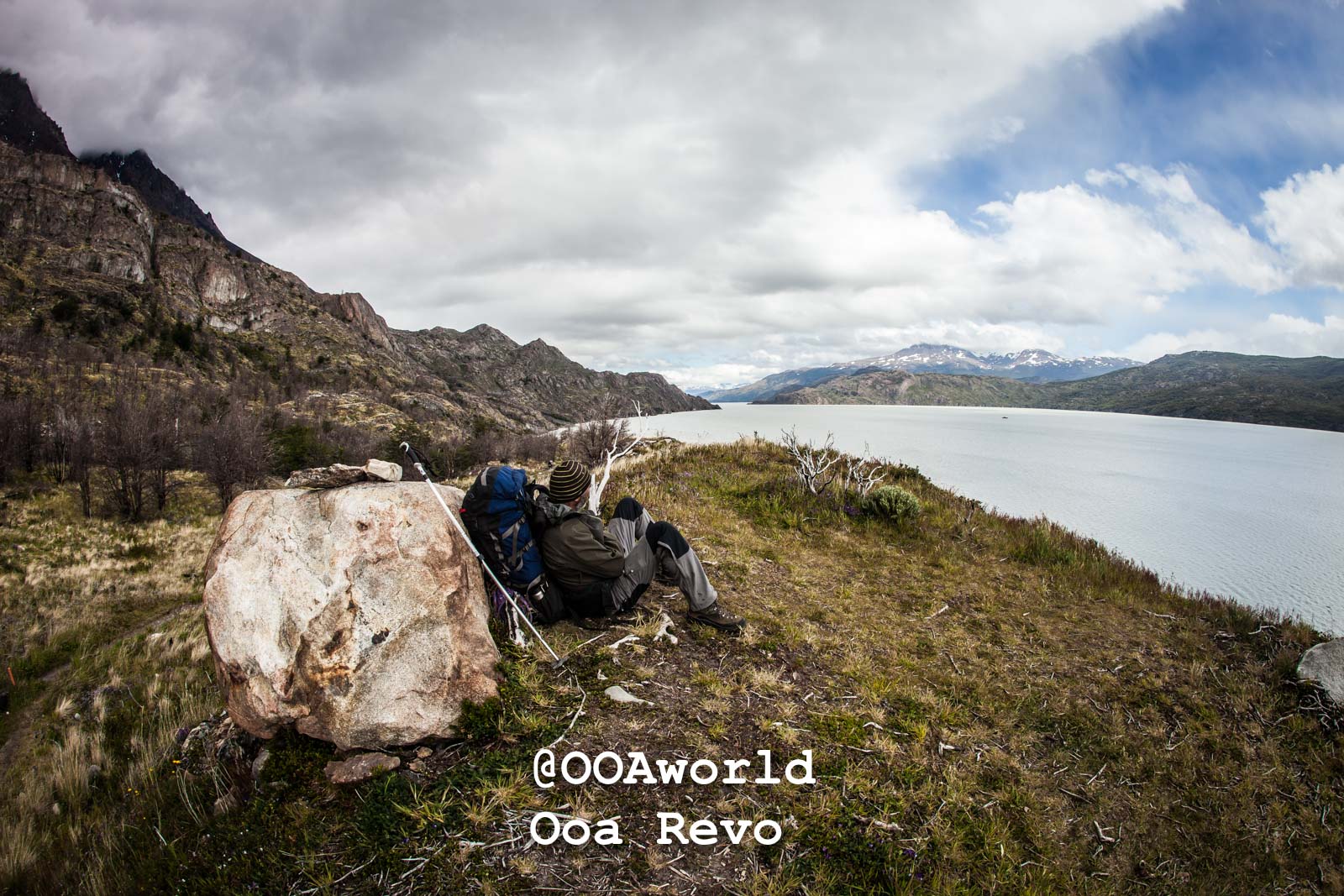 Torres Del Day Arrival Day Torres Del Paine Trek hiker relaxing by Patagonian lake mountain landscape Photo OOAworld