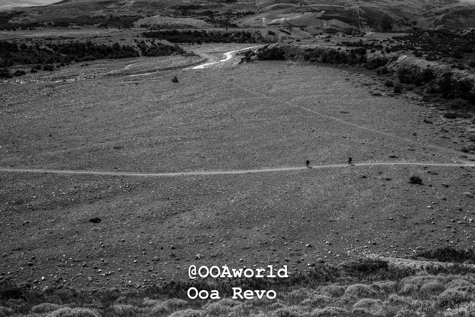 Torres Del Paine Day 4 End of Trek Torres Del Paine Trek hikers on mountain path black and white landscape Photo OOAworld