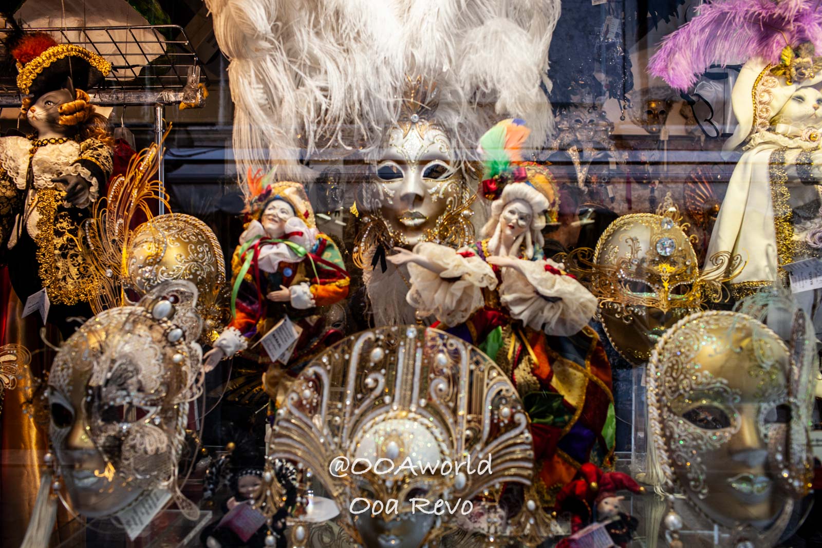 Venetian masks and dolls in a shop window Italy Photo OOAworld