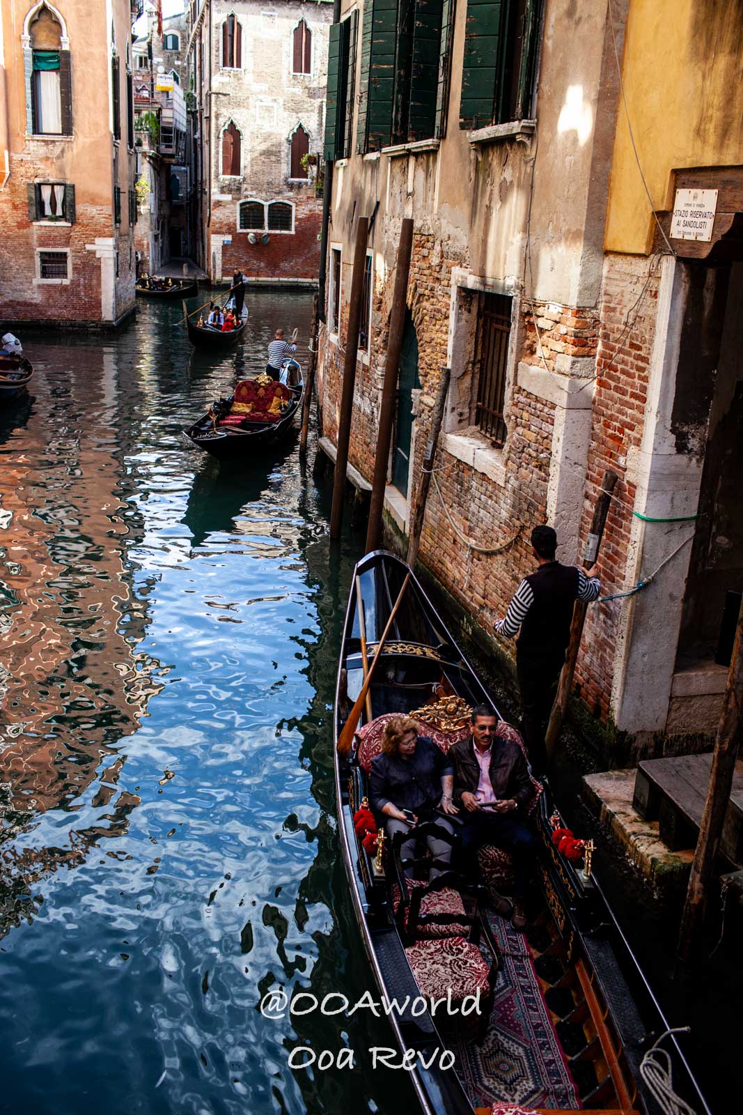Venice Italy Venice gondola ride through charming canal Photo OOAworld