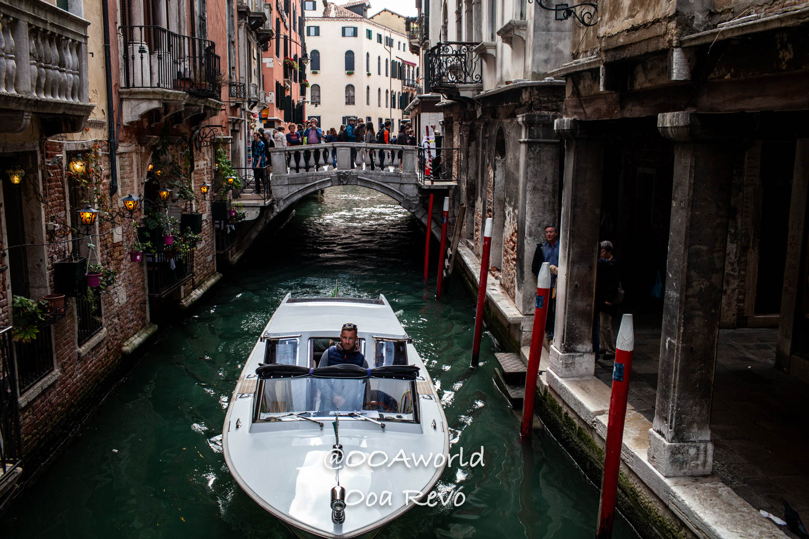 Venice Italy Venice canal with boat and bridge Photo OOAworld