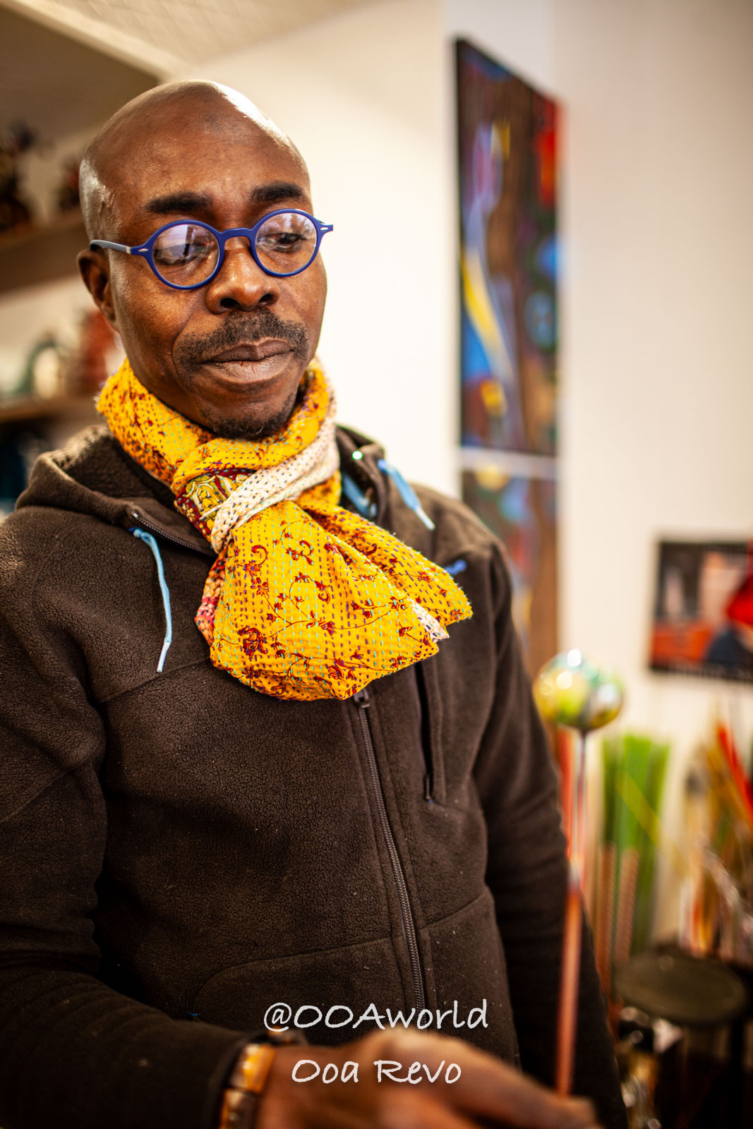 Venice Italy man wearing colorful scarf and glasses in art studio Photo OOAworld