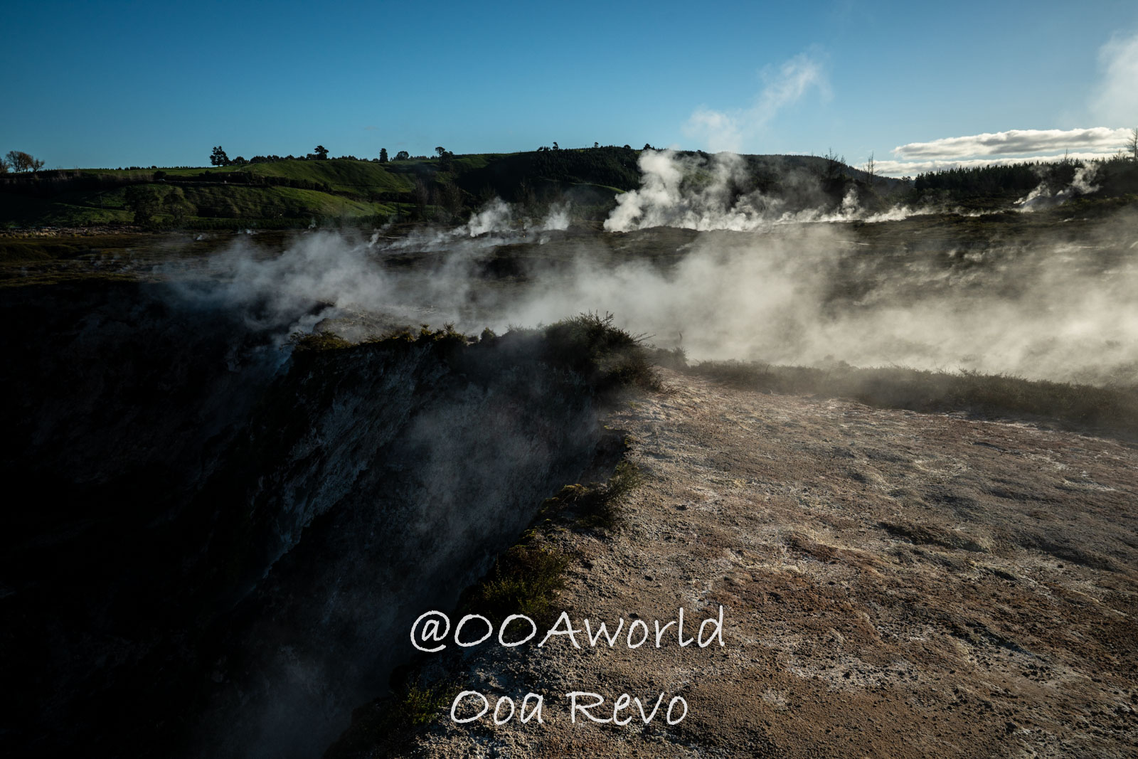 Wellington, Martinborough to Huka Falls New Zealand geothermal landscape with steam rising Photo OOAworld
