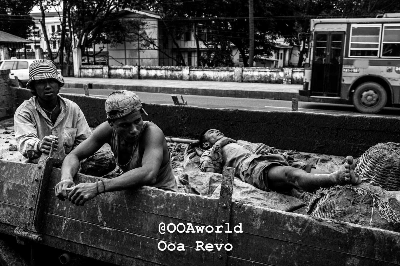 Yangon People and Streets Yangon black and white portrait of construction workers resting in a truck bed Photo OOAworld