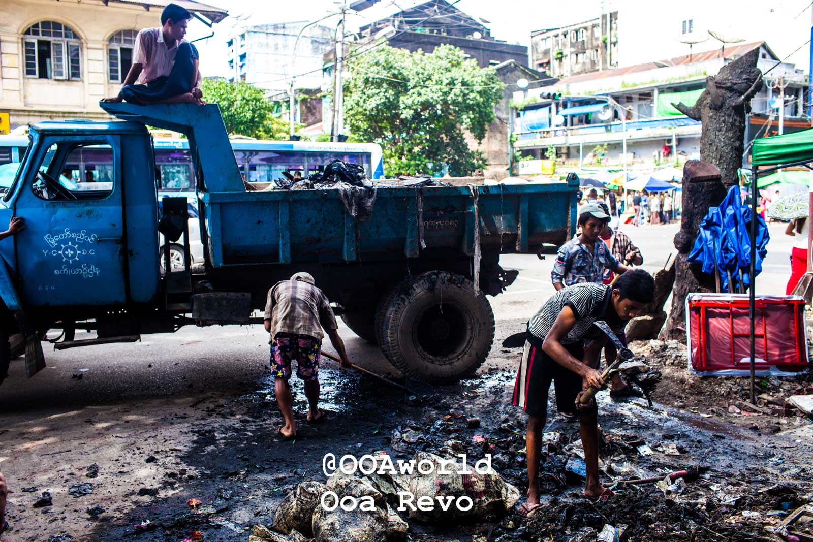 Yangon People and Streets Yangon urban street workers cleaning garbage in Asia Photo OOAworld